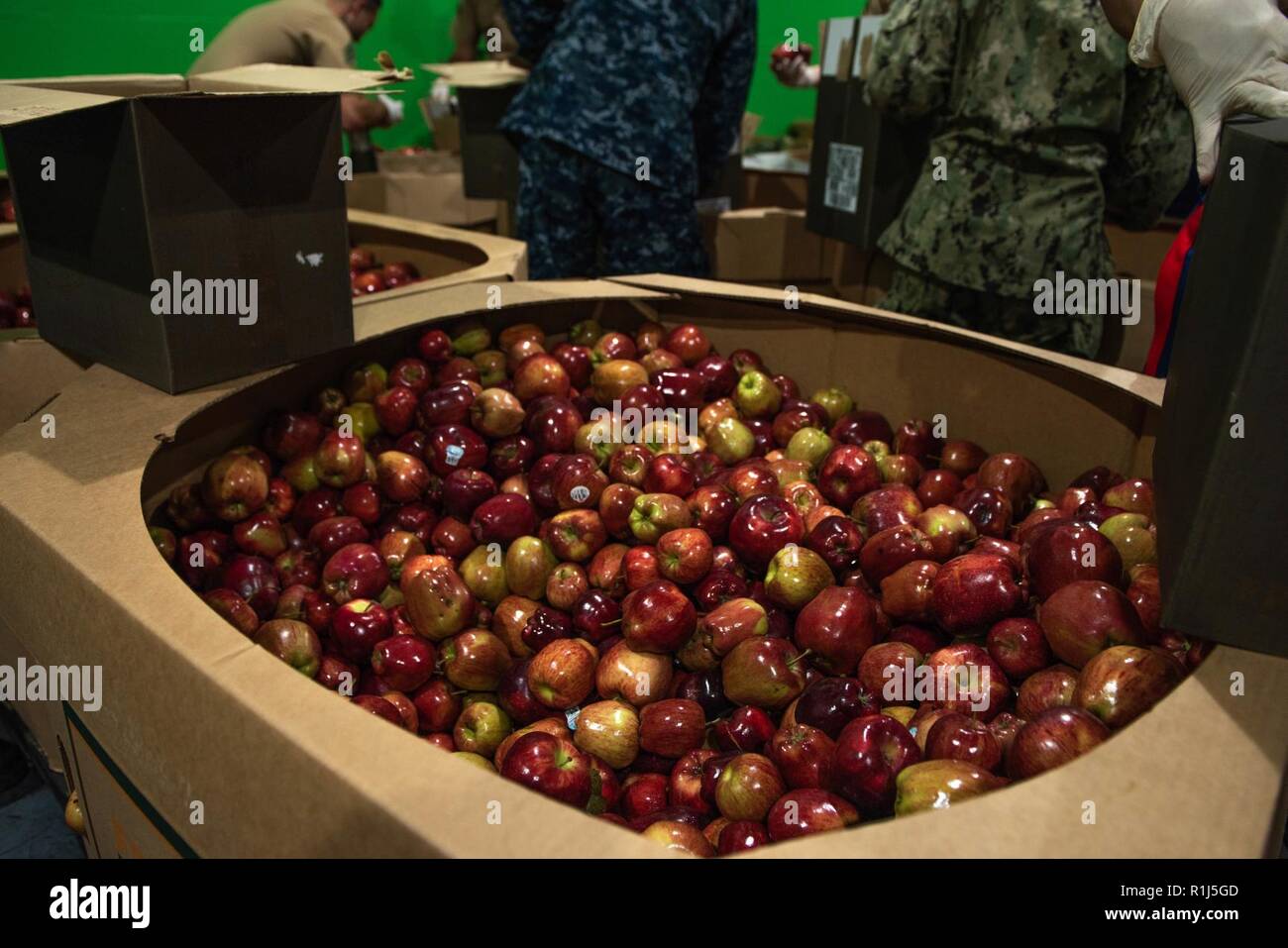 Marines And Sailors Load Boxes With Apples At The San Francisco