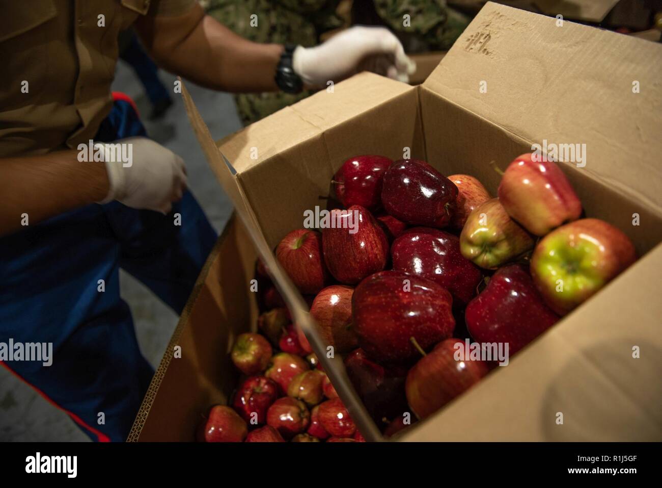 Marines And Sailors Load Boxes With Apples At The San Francisco