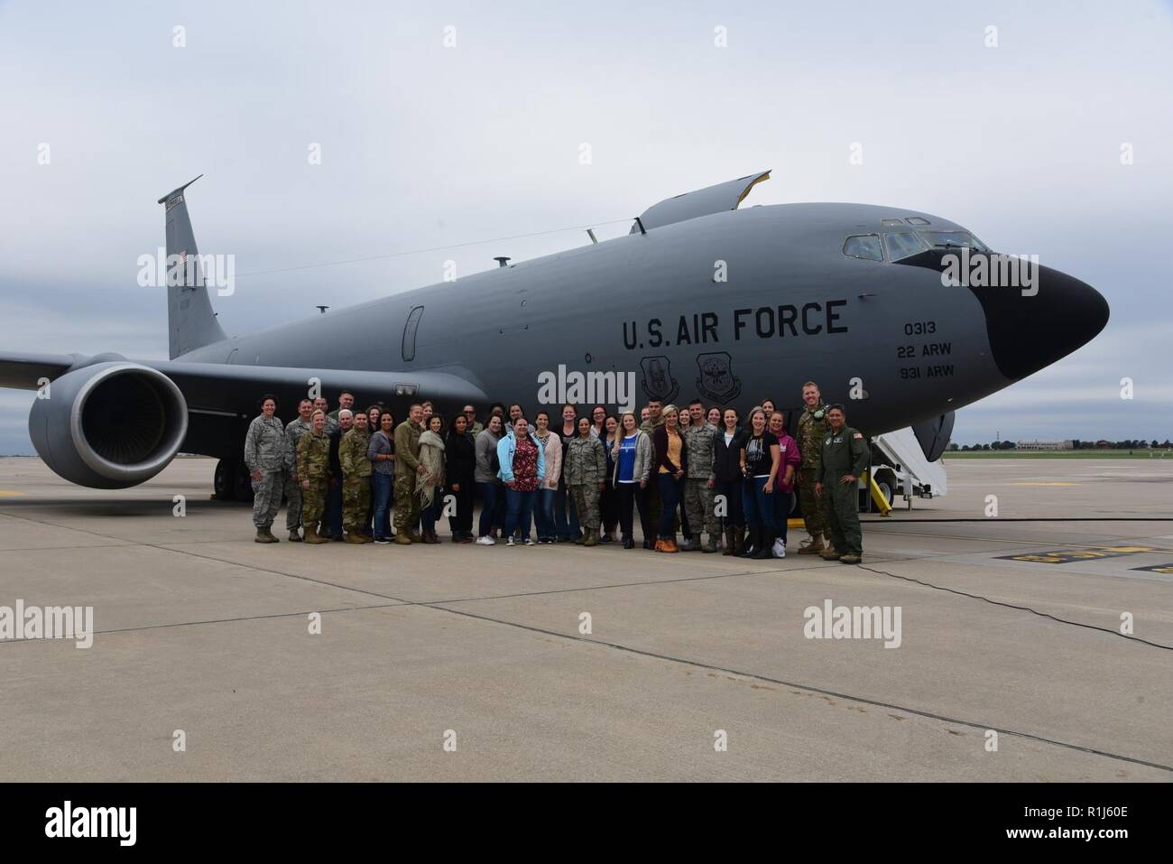 Mission Orientation Flight passengers pose for a photo in front of a KC135 Stratotanker Oct. 4