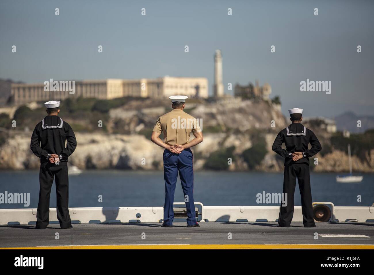 Mannig The Rails A Marine and Sailors aboard the USS Bonhomme Richard conduct the ...