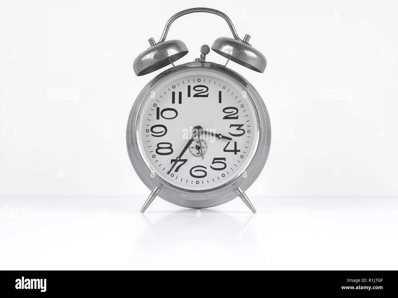 Vintage alarm clock isolated on white background Stock Photo - Alamy