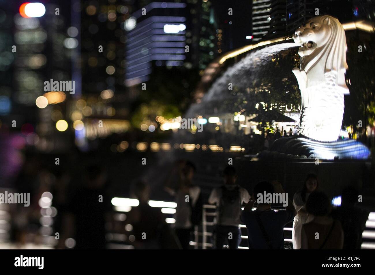 A statue of a Merlion sits a long the Singapore river, Oct. 4, 2018. The Merlion is a national symbol of the island nation of Singapore. Marines and Sailors with the 31st Marine Expeditionary Unit arrived in the “Lion City” aboard the amphibious assault ship USS Wasp (LHD 1) October 2 for a port visit after more than a month at sea during a regularly-scheduled patrol of the Indo-Pacific region. The 31st MEU, the Marine Corps' only continuously forward-deployed MEU, provides a flexible force ready to perform a wide-range of military operations. Stock Photo