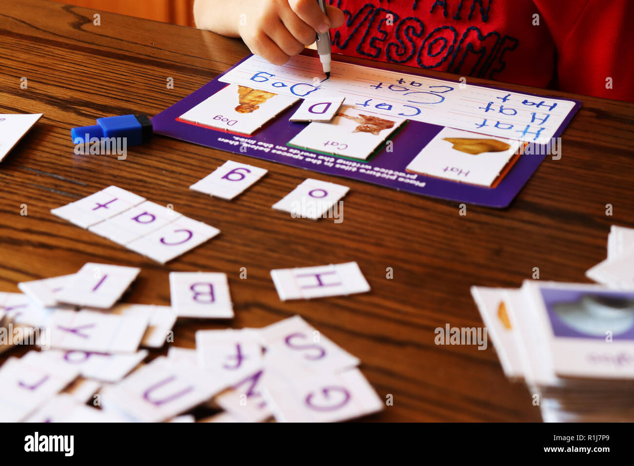 Young child learning how to write Stock Photo Alamy