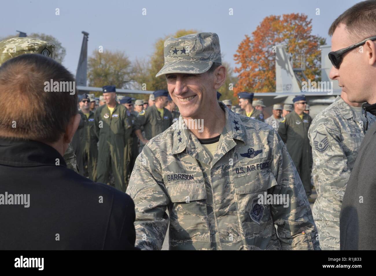 Maj. Gen. Clay L. Garrison, California Air National Guard commander, greets Mayor of Starokostiantyniv, Mykola Melnychuk, during the opening ceremony for Clear Sky 2018 exercise at Starokostiantyniv Air Base, Ukraine, Oct. 8, 2018. The exercise is a joint and multinational exercise that will involve approximately 950 personnel from nine nations. Stock Photo
