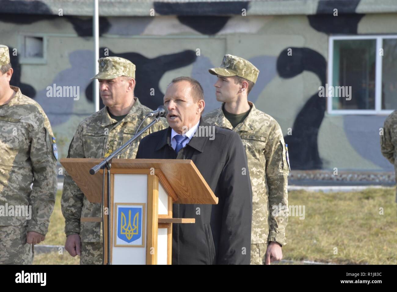 Mayor of Starokostiantyniv, Mykola Melnychuk addresses service members from participating countries during the opening ceremony for Clear Sky 2018 exercise at Starokostiantyniv Air Base, Ukraine, Oct. 8, 2018. The exercise is a joint and multinational exercise that will involve approximately 950 personnel from nine nations. Stock Photo