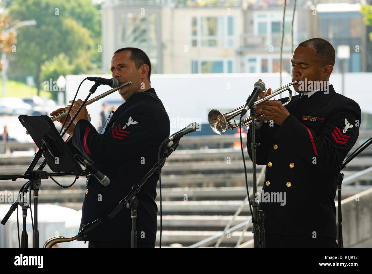 BALTIMORE (Oct. 7, 2018) Musicians 1st Class Manuel Pelayo de Góngora, left and David Smith, right of the U.S. Navy Band Cruisers perform in Baltimore’s Inner Harbor during Maryland Fleet Week and Air Show Baltimore. MDFWASB is Baltimore’s celebration of the sea services and provides an opportunity for the citizens of Maryland and the city of Baltimore to meet Sailors, Marines and Coast Guardsmen, as well as see firsthand the latest capabilities of today’s maritime services. Stock Photo