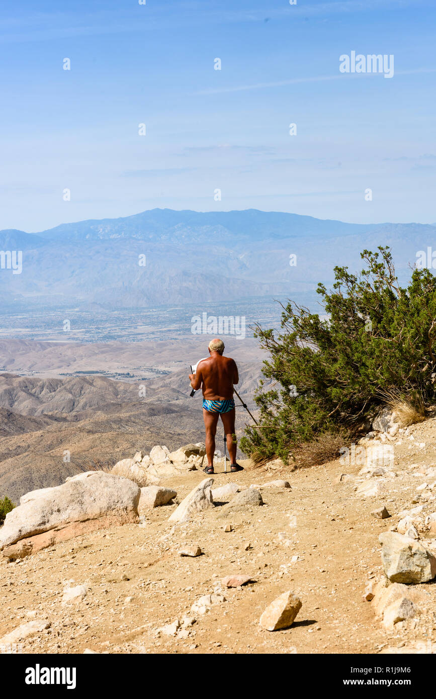 Twentynine Palms, CA-July 15, 2018: Sightseer takes photos at Keys View, overlooking the Coachella Valley at Joshua Tree National Park, California Stock Photo