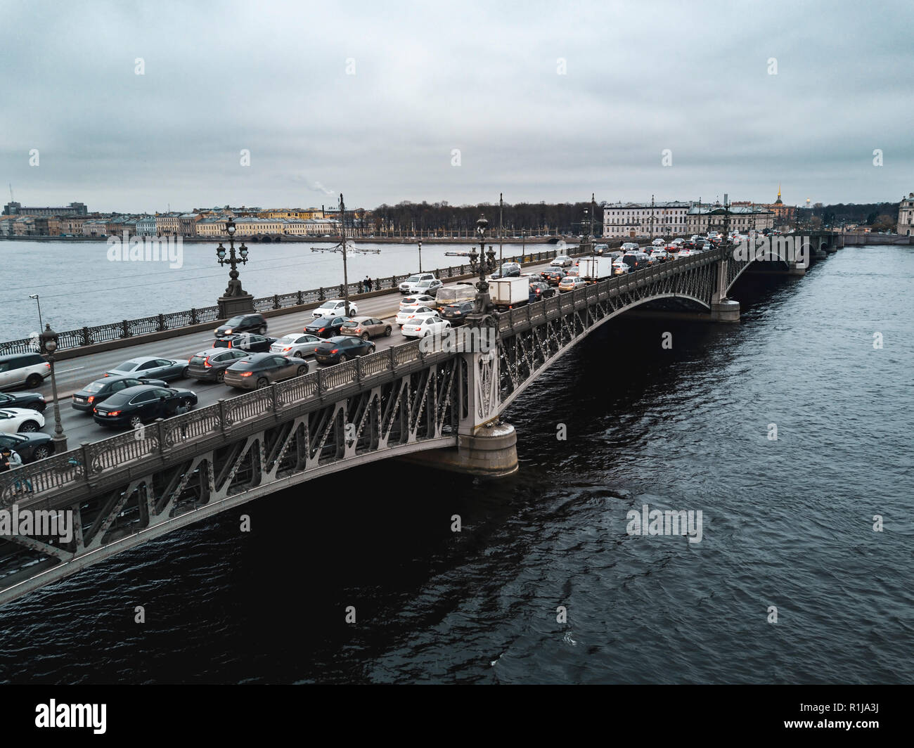 Aerial Drone View Of Troitsky Bridge Over The Neva River With A Large Congestion Of Cars Stock