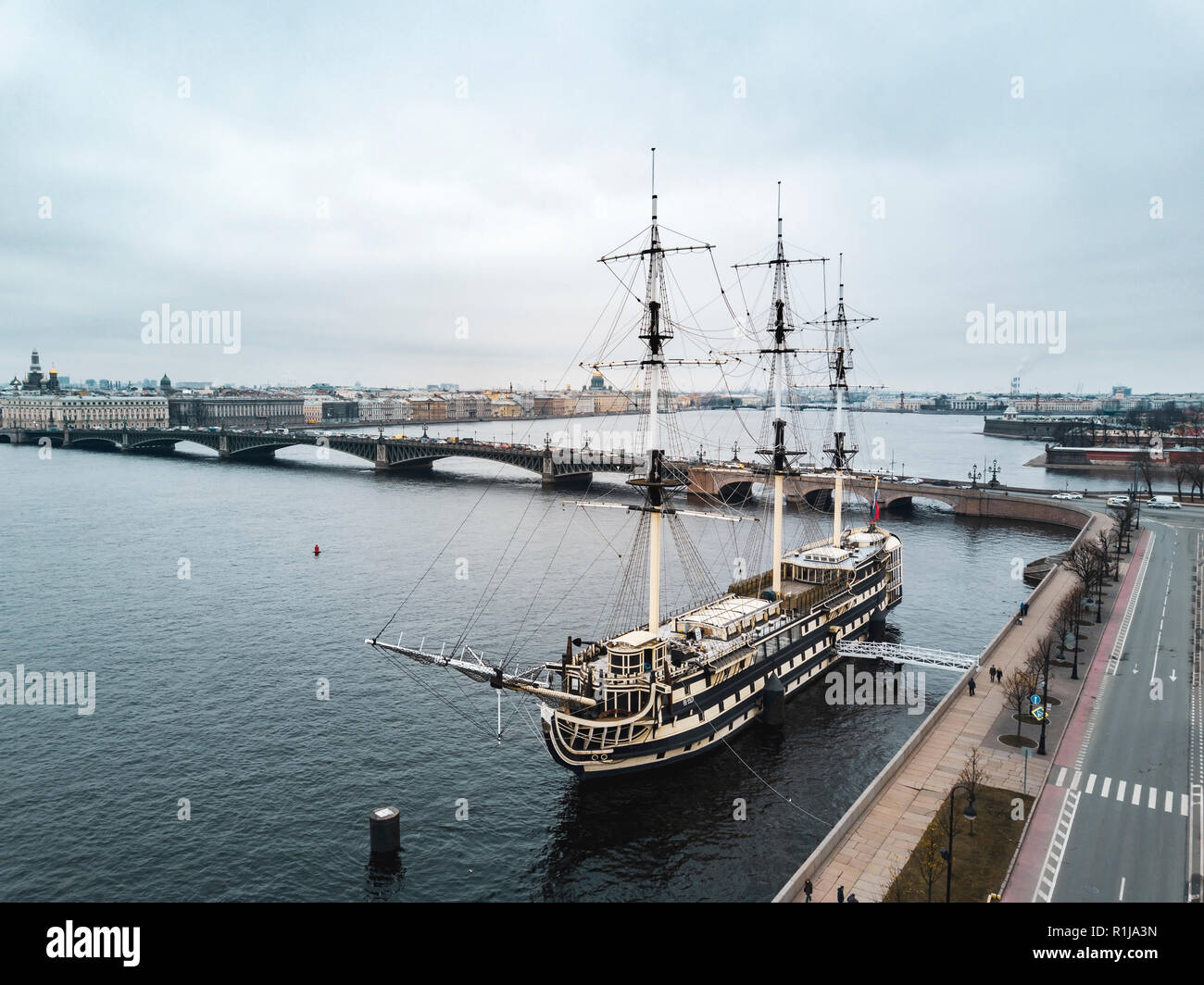 Aerial; drone view of cityscape, ship restaurant on the reconstructed linear three-deck frigate of the XVIII century; Troitsky bridge over the Neva ri Stock Photo