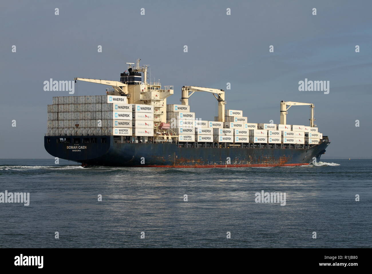 The container ship Bomar Caen passes on 19 October 2018 Terneuzen and continues to the port of Antwerp. Stock Photo