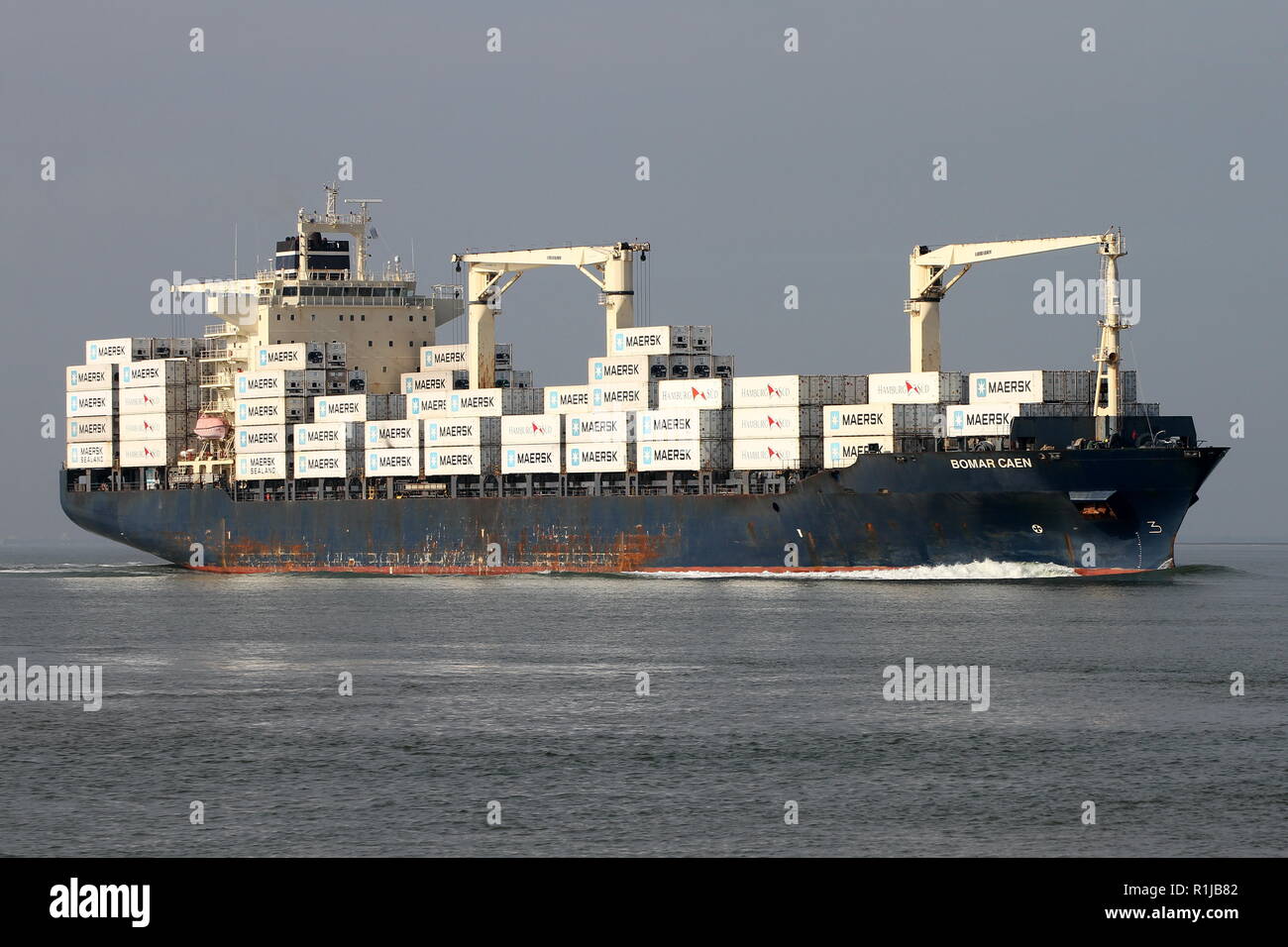 The container ship Bomar Caen passes on 19 October 2018 Terneuzen and continues to the port of Antwerp. Stock Photo