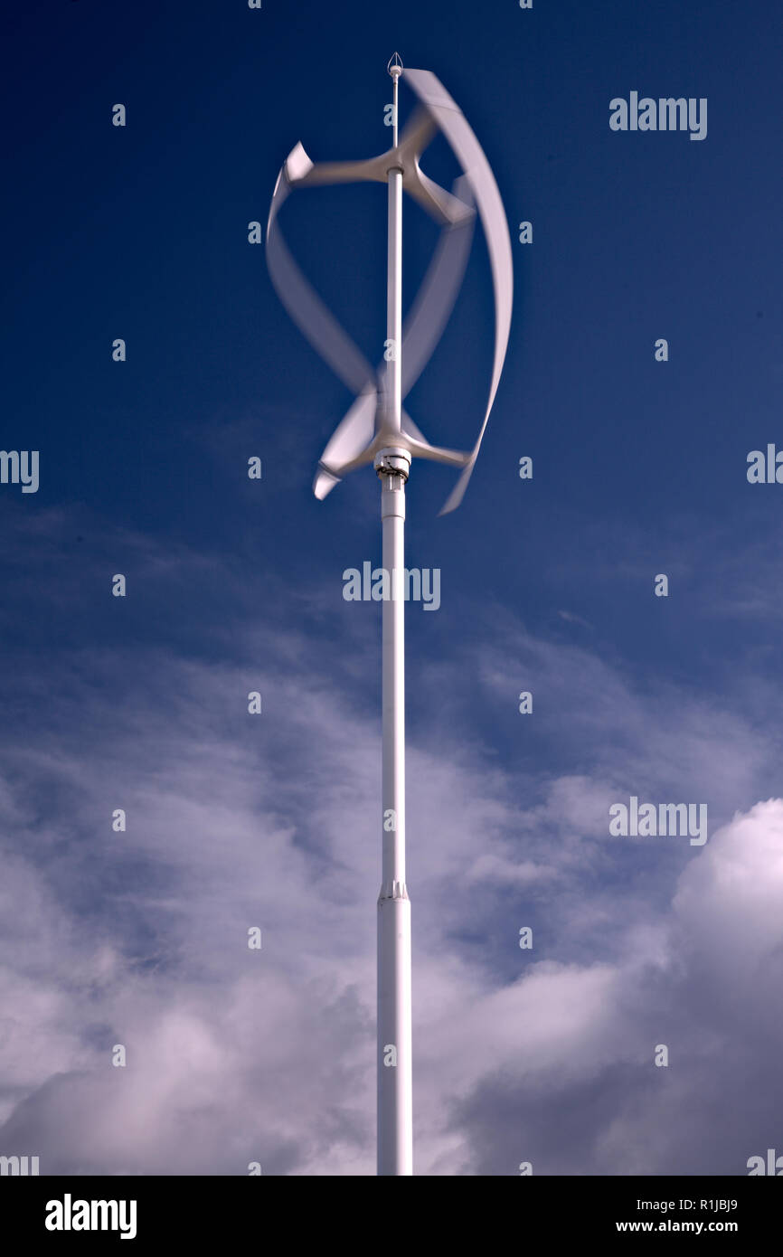 Rotating vertical axis turbine on a sunny day Stock Photo