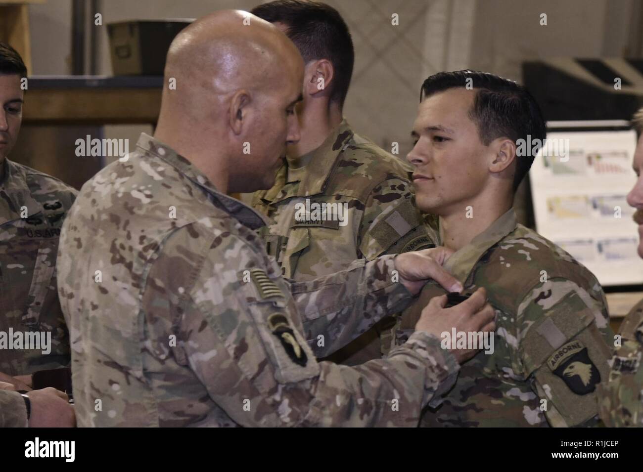 U.S. Army Soldiers assigned to Task Force Shadow were awarded the Combat Action Badge by Maj. Gen. Andrew Poppas, the Resolute Support deputy chief of staff for operations and the 101st Airborne Division (Air Assault) commander, at Bagram Airfield, Afghanistan Oct 6. The combat action badge is awarded to those individuals who personally present and actively engaging or being engaged by the enemy. Stock Photo