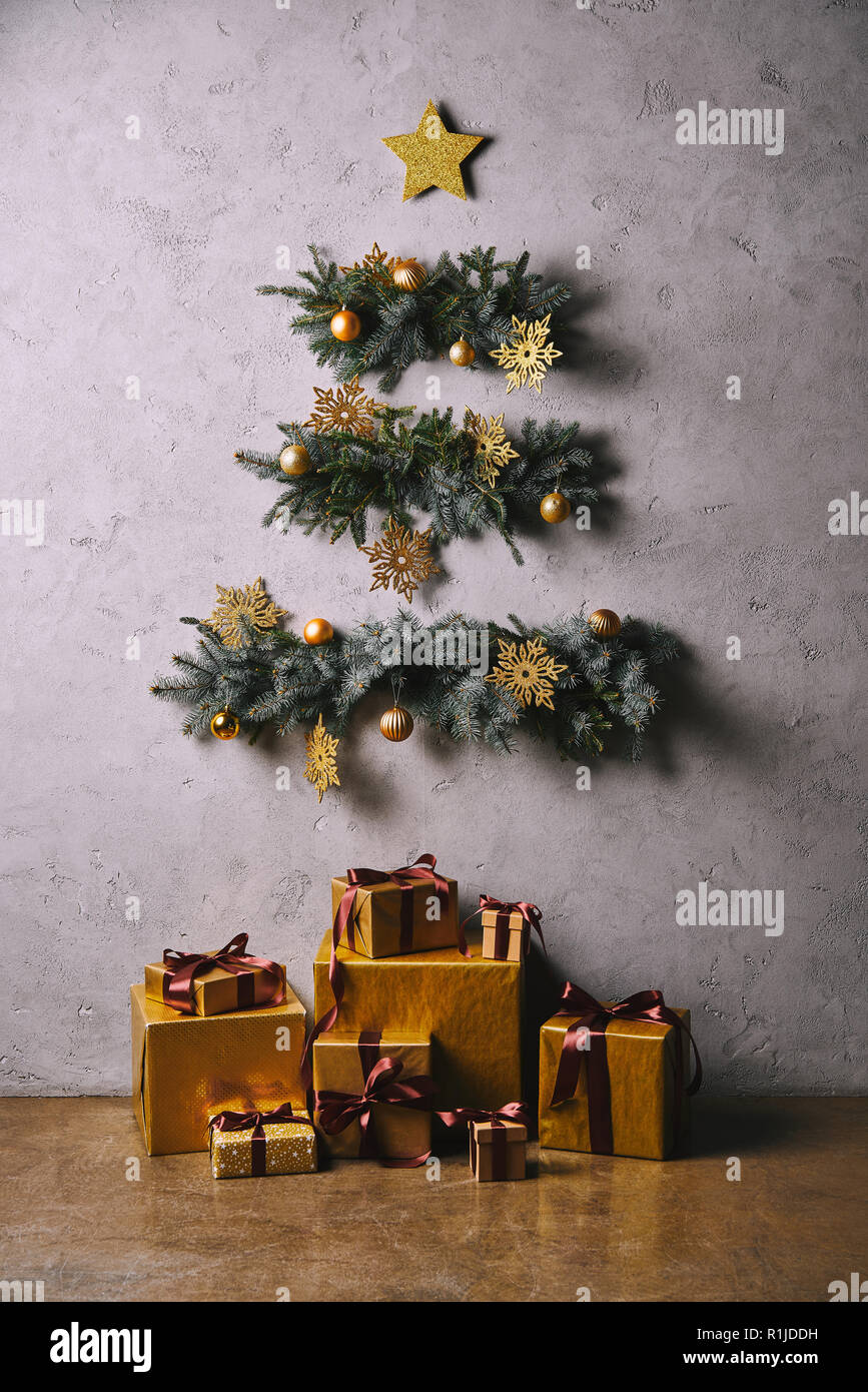 Handmade Christmas Tree Made Of Twigs Hanging On Grey Wall Gift