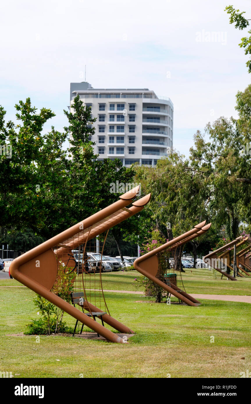 A row of wooden seats in Bicentennial Park in Darwin, Northern Territory, Australia Stock Photo