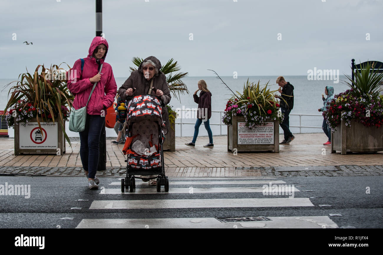 People going about their daily life in the rain. Stock Photo