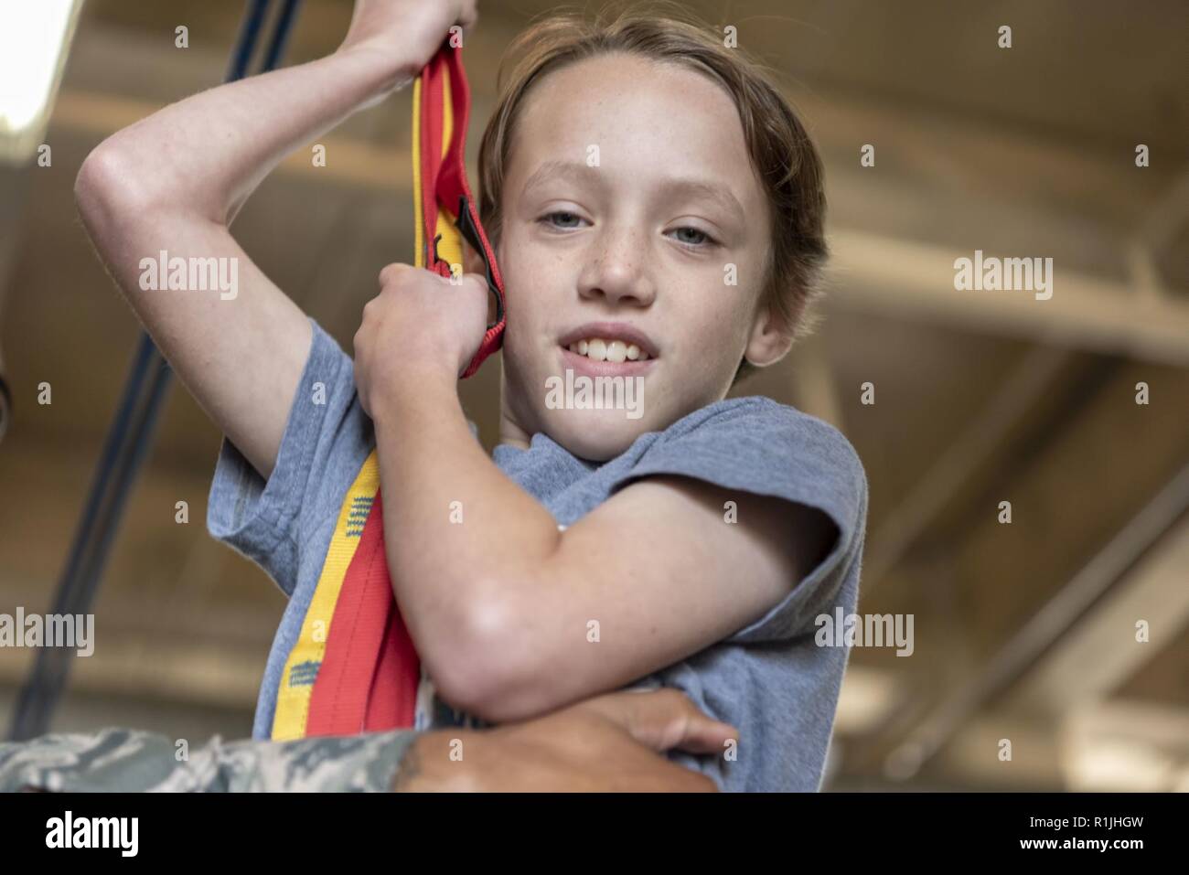 An attendee rides on a zipline during Fire Prevention Week at Misawa