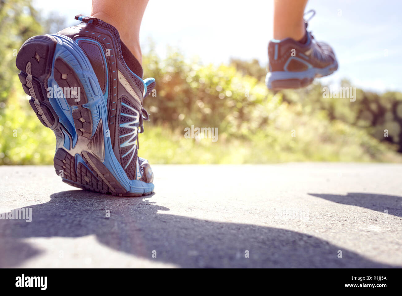 Running in summer sunshine concept for exercising, fitness and healthy lifestyle Stock Photo