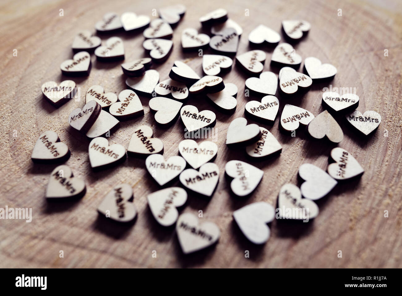 Mr and Mrs wedding decoration hearts on a wooden table Stock Photo