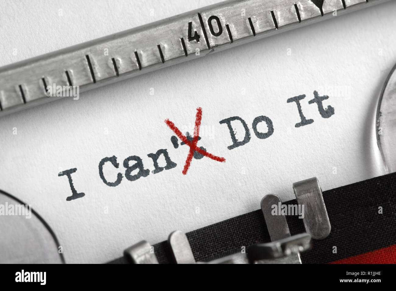 Can't crossed out to read I can do it concept for self belief, positive attitude and  motivation written on an old typewriter Stock Photo