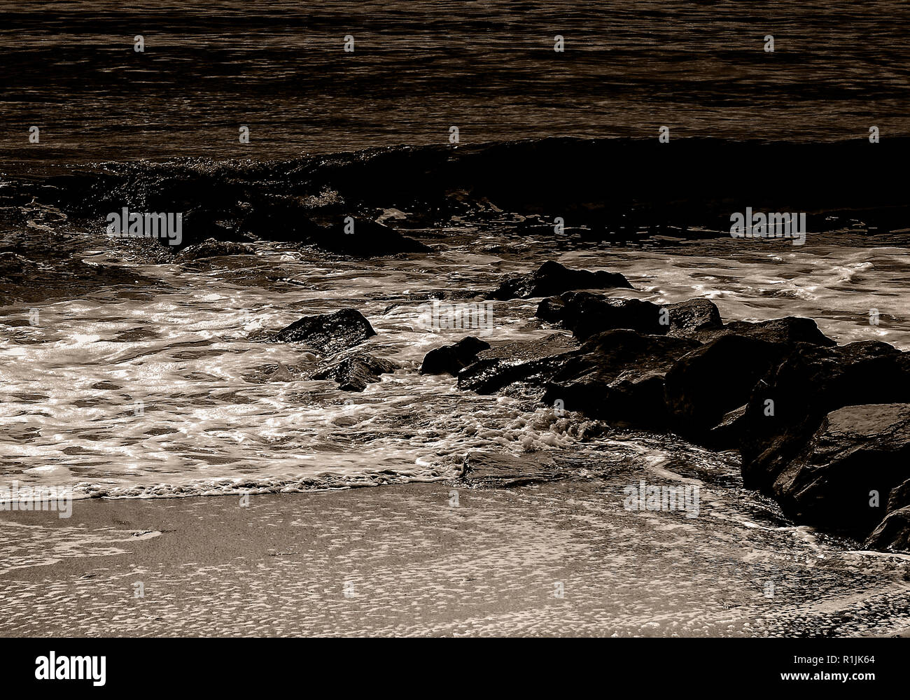 Small Rocks Braking Small breaking waves hi-res stock photography and images - Alamy