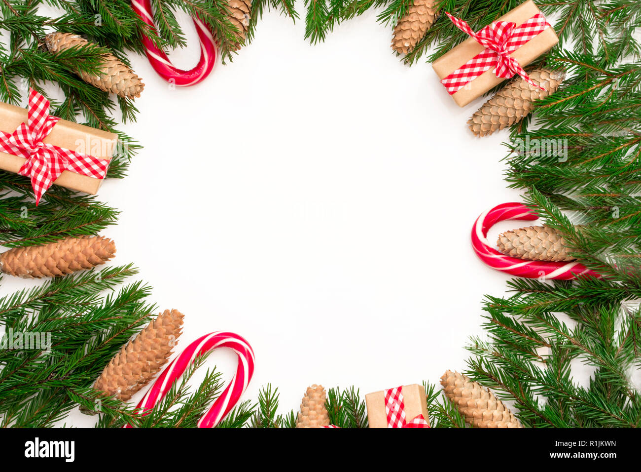 Christmas composition. Round frame of fir branches and cones on white ...