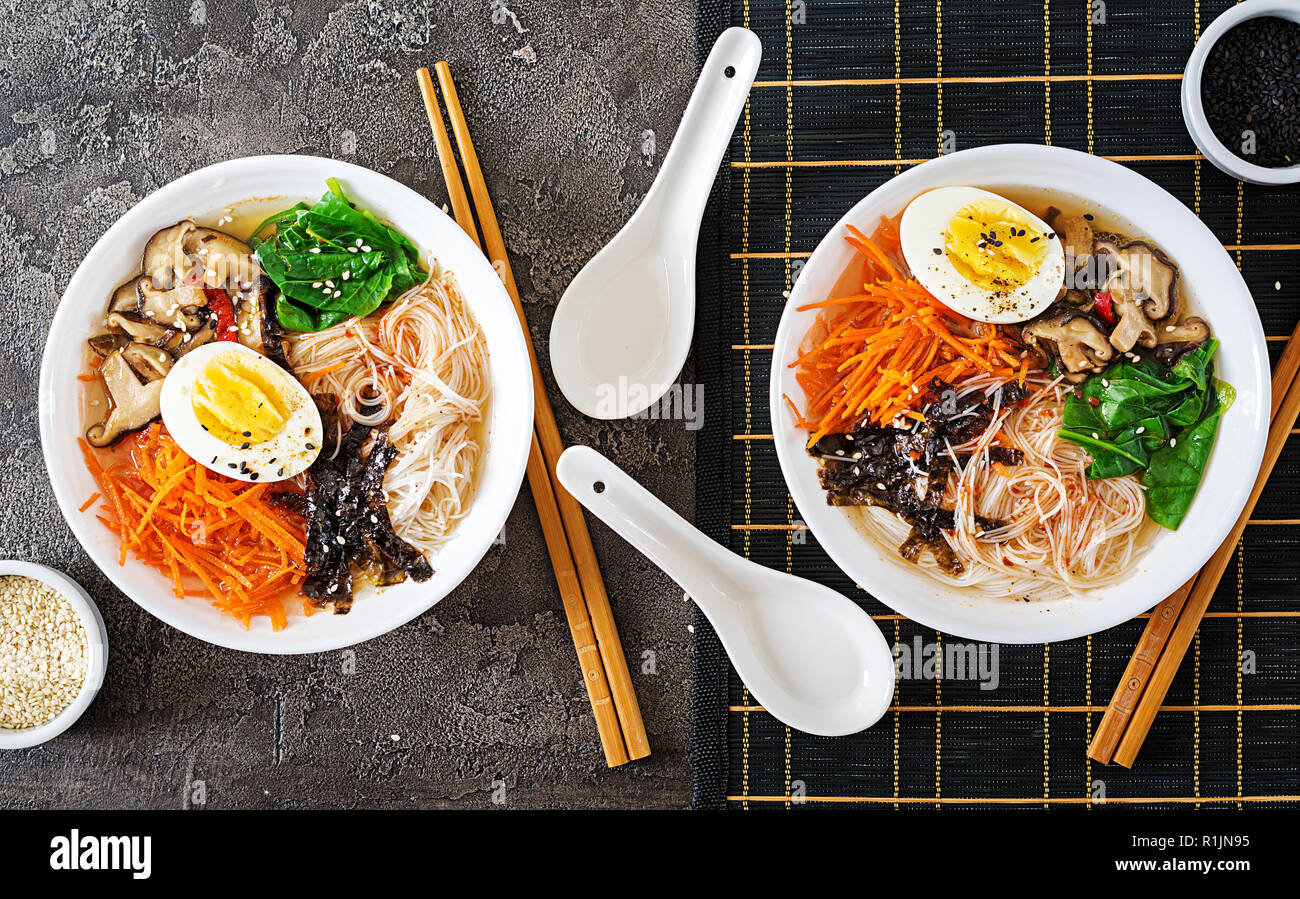 Diet vegetarian bowl of noodle soup of shiitake mushrooms, carrot and