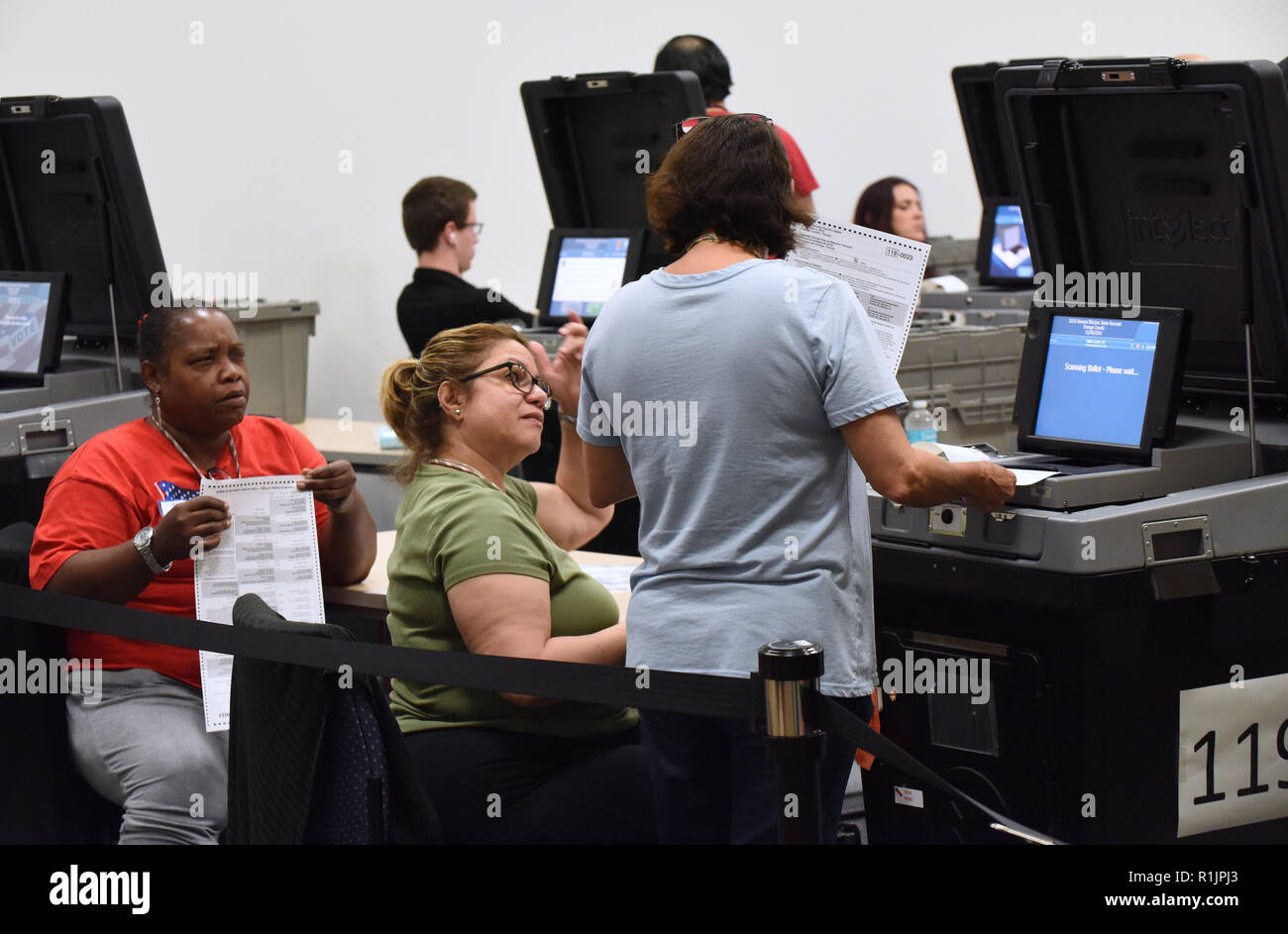 Orlando, Florida, USA. November 12, 2018 - Orlando, Florida, United States - Election workers scan ballots as a recount begins on November 12, 2018 at the Orange County Supervisor of Elections Office in Orlando, Florida. A statewide vote recount is being conducted to determine the winners of the races for governor, U.S. senate, and agriculture commissioner. (Paul Hennessy/Alamy) Credit: Paul Hennessy/Alamy Live News Stock Photo