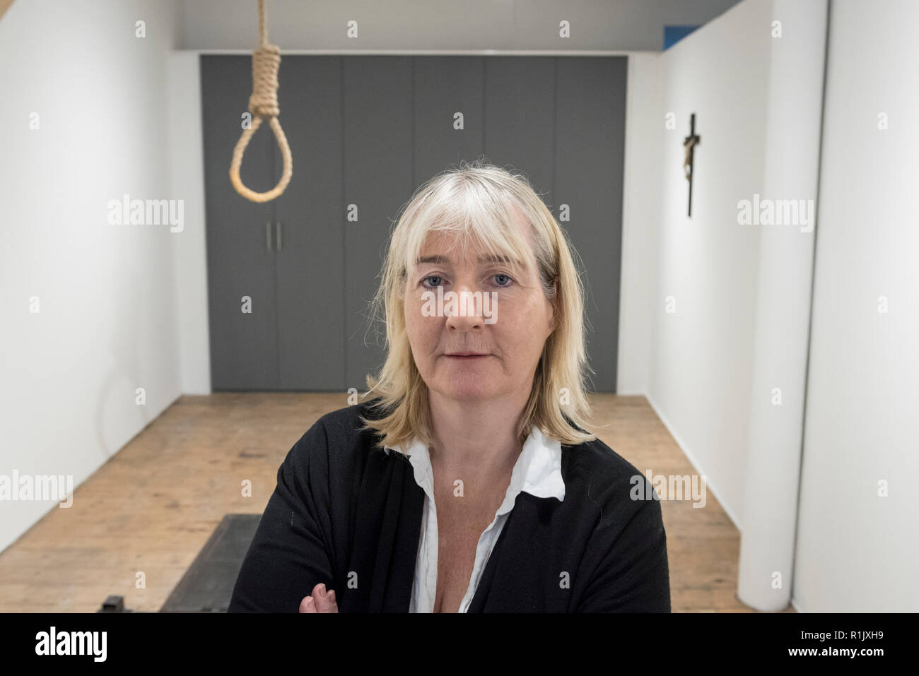 London, UK.  13 November 2018. Artist Christina Reihill poses with a hangman's noose.  Preview of 'Glad I Did It', a new work by Irish artist Christina Reihill at Bermondsey Project Space.  The interactive artwork looks at the life and death of Ruth Ellis, the last woman to be hanged in Britain, after she shot her lover, racing driver, David Blakely in 1955.  On display are the artist's interpretation of Ruth Ellis' prison cell, including furniture and props, the hanging room together with a video display of the artist in conversation. Credit: Stephen Chung/Alamy Live News Stock Photo