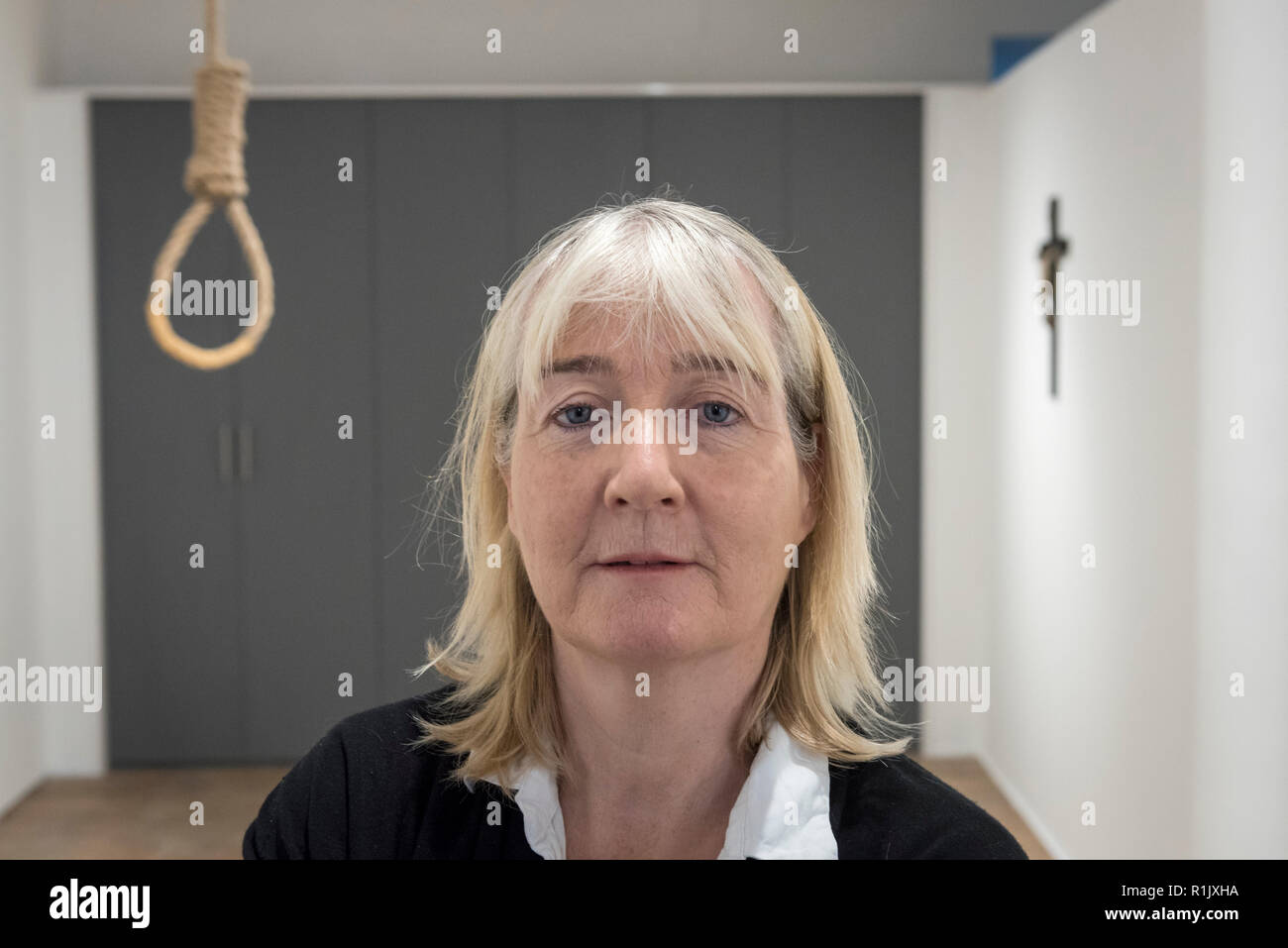 London, UK.  13 November 2018. Artist Christina Reihill poses with a hangman's noose.  Preview of 'Glad I Did It', a new work by Irish artist Christina Reihill at Bermondsey Project Space.  The interactive artwork looks at the life and death of Ruth Ellis, the last woman to be hanged in Britain, after she shot her lover, racing driver, David Blakely in 1955.  On display are the artist's interpretation of Ruth Ellis' prison cell, including furniture and props, the hanging room together with a video display of the artist in conversation. Credit: Stephen Chung/Alamy Live News Stock Photo