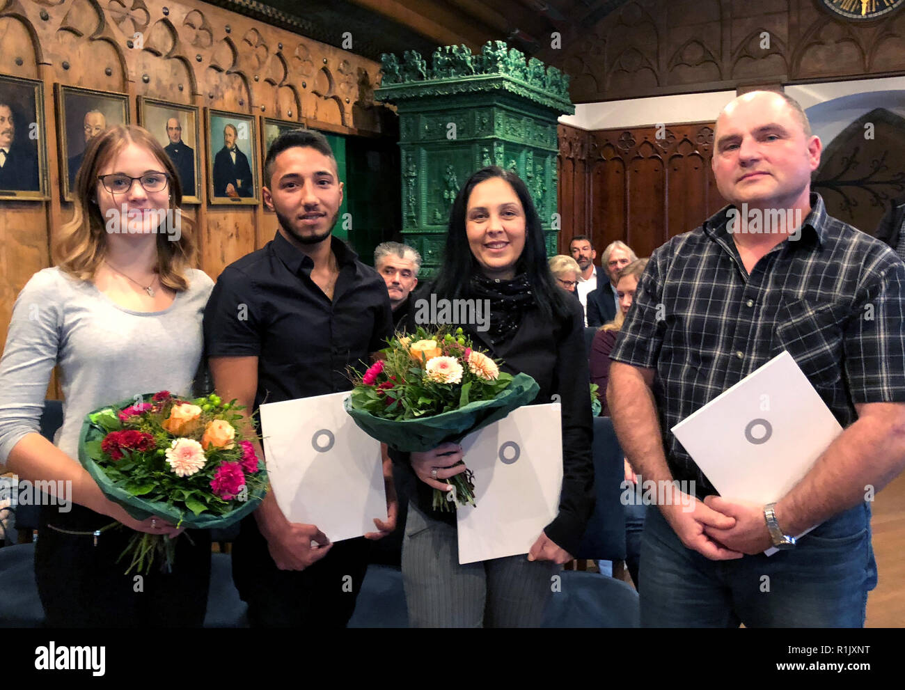 Ravensburg, Germany. 13th Nov, 2018. Nina Bäumler (l-r), Bilal Hasan,  Aferdita Gau and Olaf Klingler stand together in a tribute for their  courageous intervention in a knife attack. They had stood in