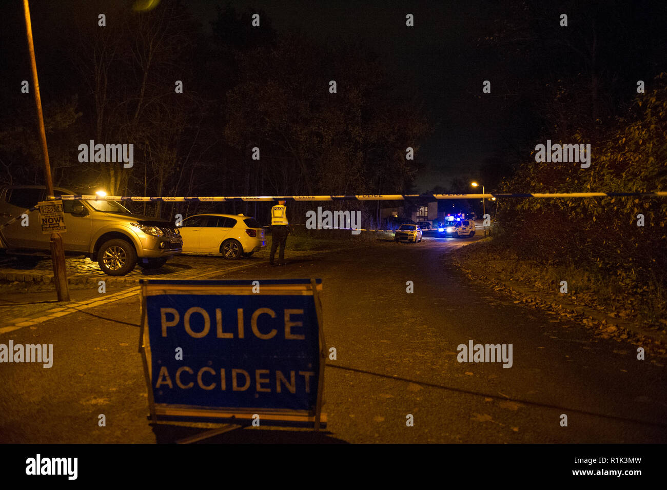 Cumbernauld, UK. 13th Nov, 2018. Police Incident of a suspected attack in the Seafar area of Cumbernauld at 8pm. Police have cordoned off the area with tape and are investigating but not giving any details out. One person has been taken away in an ambulance with the blue lights and siren on.  A car remains on the scene along with a heavily wooded area cordoned off for investigation. Around 5 officers, 2 police units and an ambulance were in attendance.  Credit: Colin Fisher/Alamy Live News Stock Photo