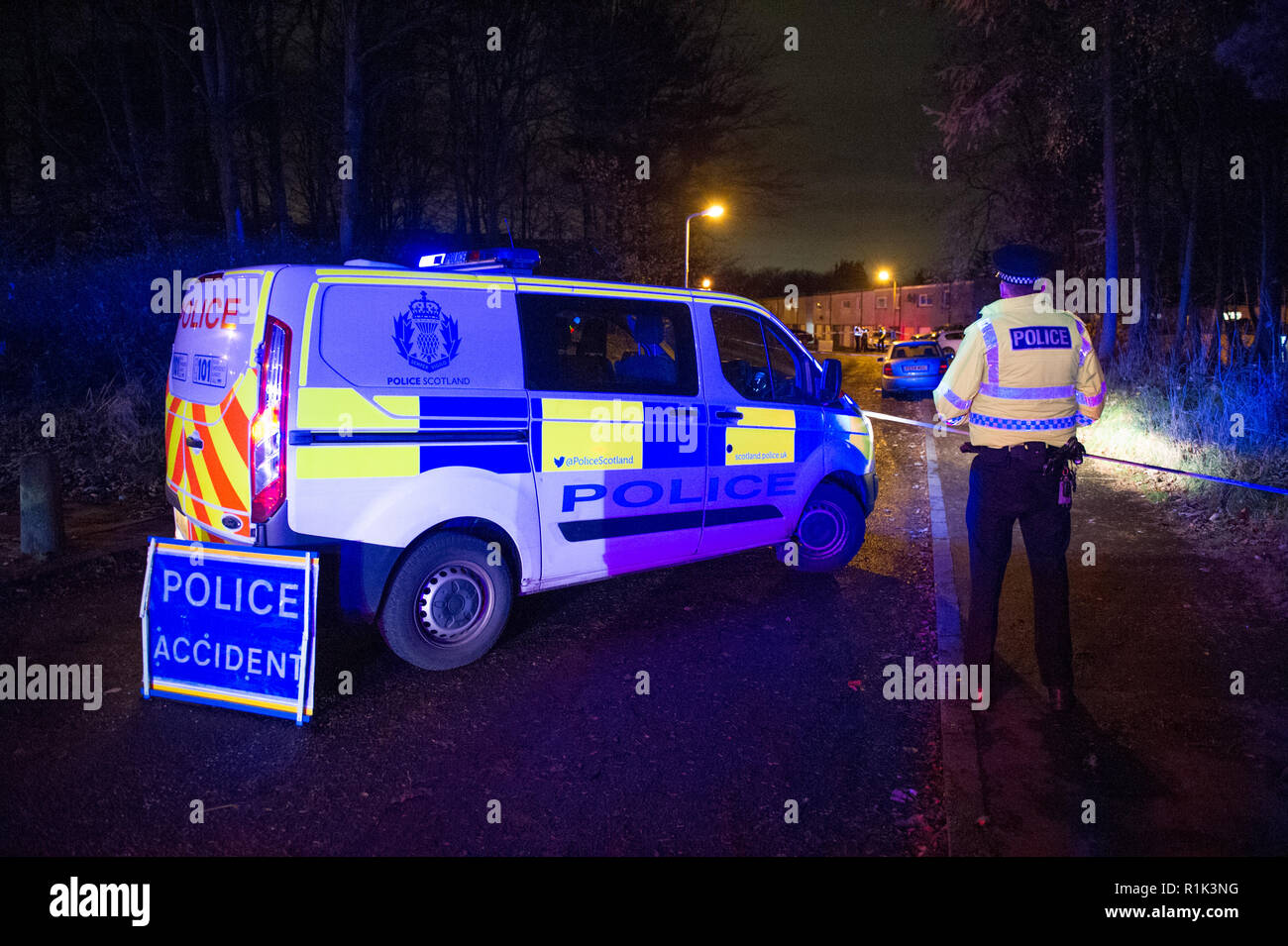 Cumbernauld, UK. 13th Nov, 2018. Police Incident of a suspected attack in the Seafar area of Cumbernauld at 8pm. Police have cordoned off the area with tape and are investigating but not giving any details out. One person has been taken away in an ambulance with the blue lights and siren on.  A car remains on the scene along with a heavily wooded area cordoned off for investigation. Around 5 officers, 2 police units and an ambulance were in attendance.  Credit: Colin Fisher/Alamy Live News Stock Photo