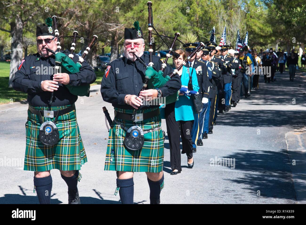 The Las Vegas Emerald Society plays Amazing Grace on bagpipes while leading the funeral procession to the final resting place during the Missing in Nevada ceremony, 09 October, 2018, Southern Nevada Veterans Memorial Cemetery, Boulder City, Nev.    The purpose of the Missing in America Project is to locate, identify and inter the unclaimed cremated remains of American veterans through the joint efforts of private, state and federal organizations. Stock Photo