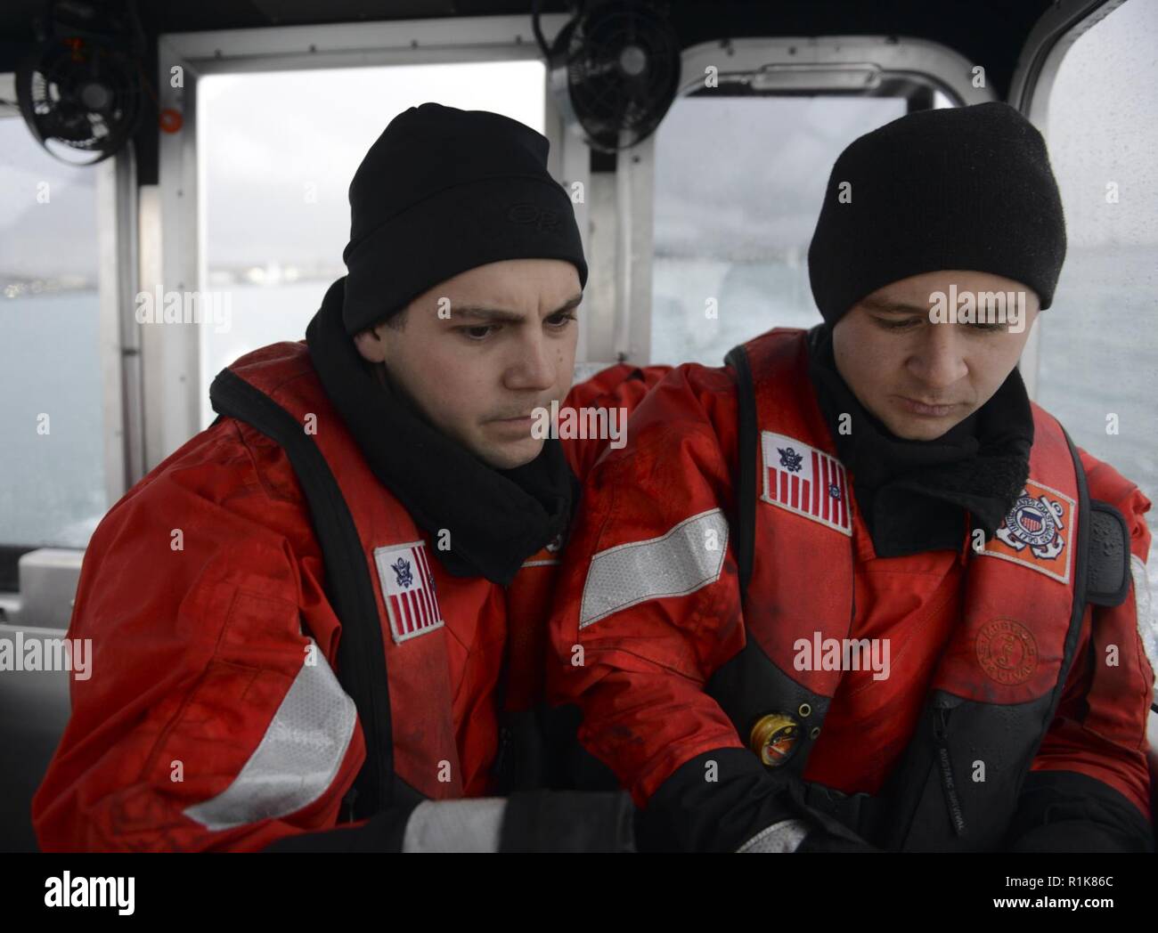 Petty Officers 3rd Class Alex Sheltra (left) and Joseph Echols, boat ...