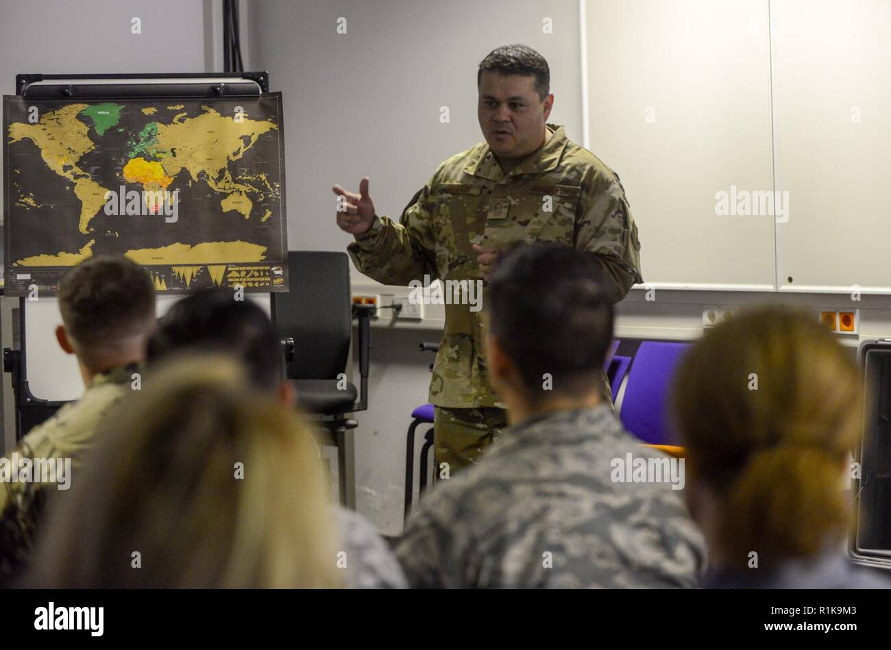 U.S. Air Force Chief Master Sgt. Ernesto J. Rendon Jr., 86th Airlift Wing command chief, talks to Airmen of the 86th Aircraft Maintenance Squadron during an immersion tour of the 86th Maintenance Group on Ramstein Air Base, Germany, Oct. 9, 2018. Rendon and Brig. Gen. Mark R. August, 86th AW commander, used the immersion as a way to get a better understanding of the 86th MXG’s capabilities as well as a way for Airmen to ask questions directly to the wing leaders. Stock Photo