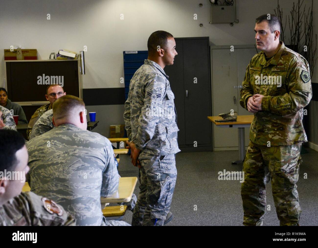 U.S. Air Force Brig. Gen. Mark R. August, 86th Airlift Wing commander, listens to a question from an Airman during an immersion tour of the 86th Maintenance Group on Ramstein Air Base, Germany, Oct. 9, 2018. August and Chief Master Sgt. Ernesto J. Rendon Jr., 86th AW command chief, used the immersion as a way to get a better understanding of the 86th MXG’s capabilities as well as a way for Airmen to ask questions directly to the wing leaders. Stock Photo