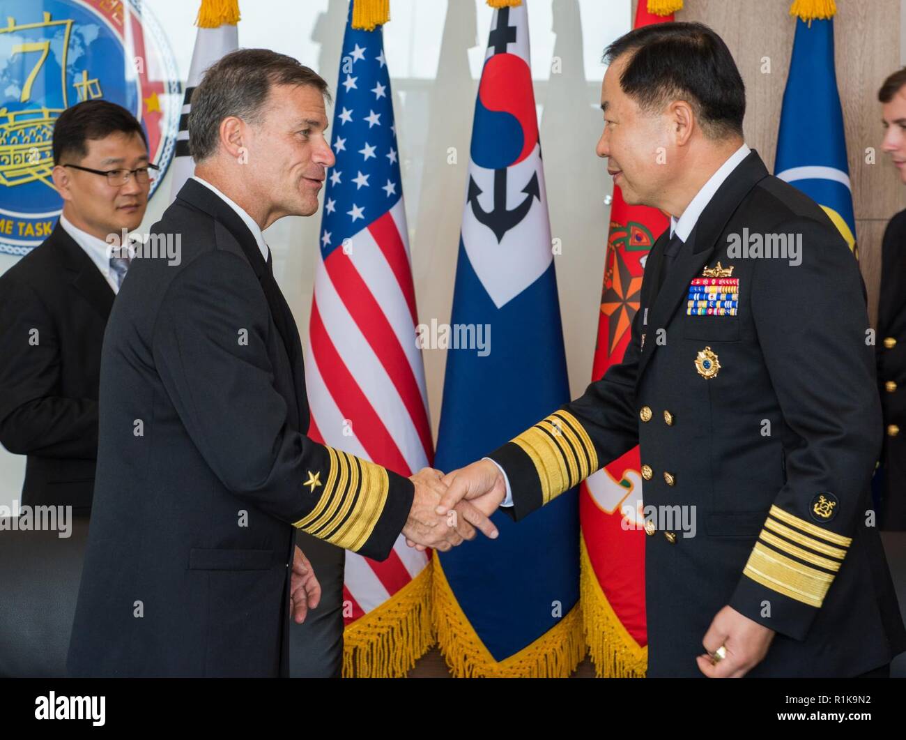 JEJU ISLAND, Republic of Korea, Republic of Korea (Oct. 11, 2018) Adm. John Aquilino, commander, U.S. Pacific Fleet, shakes hands with Republic of Korea (ROK) Chief of Naval Operations (CNO) Adm. Sim, Seung-seob during an office call in Jeju. Aquilino is visiting the ROK to observe the 2018 ROK International Fleet review as well as attend the 2018 Western Pacific Naval Symposium being hosted by the ROK Navy. Stock Photo