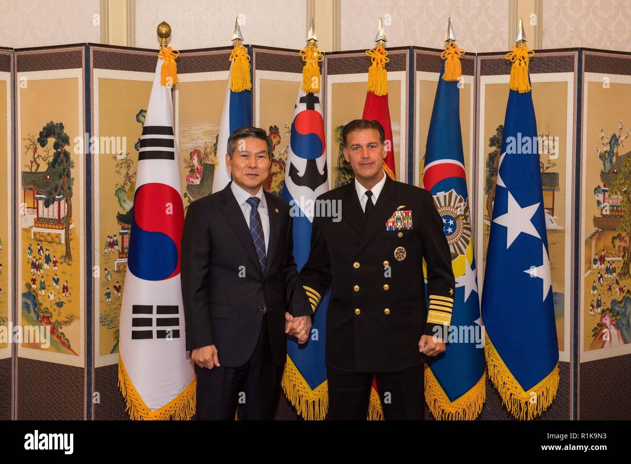 JEJU ISLAND, Republic of Korea, Republic of Korea (Oct. 12, 2018) Minister Jeong, Kyeong-doo, ROK Minister of National Defense, and Adm. John Aquilino, commander, U.S. Pacific Fleet, pose together for a photo during an office call in Jeju. Aquilino is visiting the ROK to observe the 2018 ROK International Fleet review as well as attend the 2018 Western Pacific Naval Symposium being hosted by the ROK Navy. Stock Photo