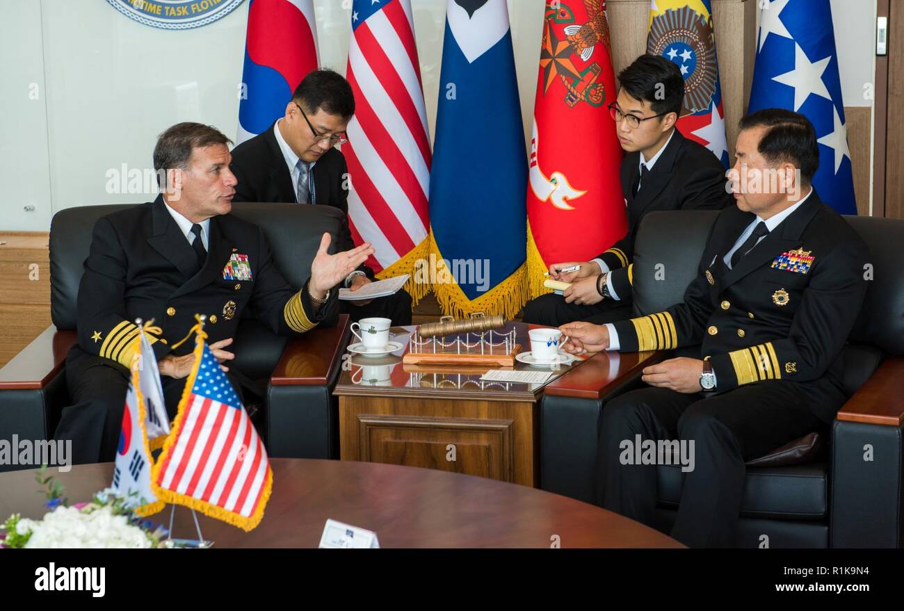 JEJU ISLAND, Republic of Korea, Republic of Korea (Oct. 11, 2018) Adm. John Aquilino, commander, U.S. Pacific Fleet, speaks with Republic of Korea (ROK) Chief of Naval Operations (CNO) Adm. Sim, Seung-seob during an office call in Jeju. Aquilino is visiting the ROK to observe the 2018 ROK International Fleet review as well as attend the 2018 Western Pacific Naval Symposium being hosted by the ROK Navy. Stock Photo
