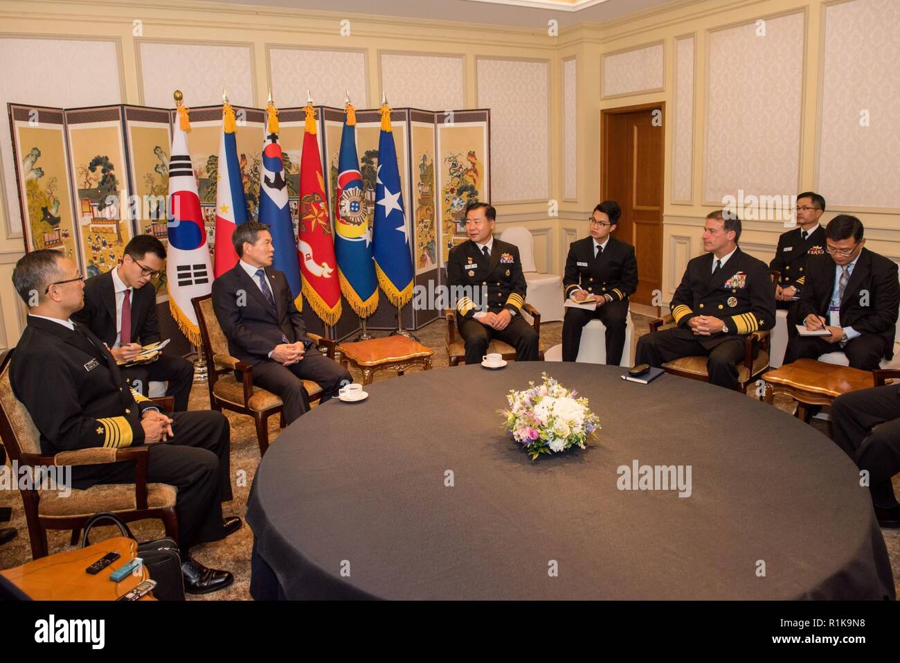 JEJU ISLAND, Republic of Korea, Republic of Korea (Oct. 12, 2018) Minister Jeong, Kyeong-doo, Republic of Korea (ROK) minister of national defense speaks with ROK Navy Chief of Naval Operations Adm. Sim, Seung-seob (center), Adm. Yutaka Murakawa, chief of maritime staff for Japan Maritime Self-Defense Force (left), and Adm. John Aquilino, commander, U.S. Pacific Fleet (right), during an office call in Jeju. Aquilino is visiting the ROK to observe the 2018 ROK International Fleet review as well as attend the 2018 Western Pacific Naval Symposium being hosted by the ROK Navy. Stock Photo
