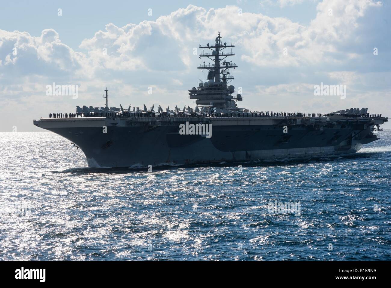 JEJU ISLAND, Republic of Korea, Republic of Korea (Oct. 11, 2018) The nuclear-powered aircraft carrier USS Ronald Reagan (CVN 76) participates in a pass-in-review during the Republic of Korea (ROK) 2018 International Fleet Review (IFR). The IFR is conducted every 10 years and has participants and observers from more than 20 foreign navies. Stock Photo