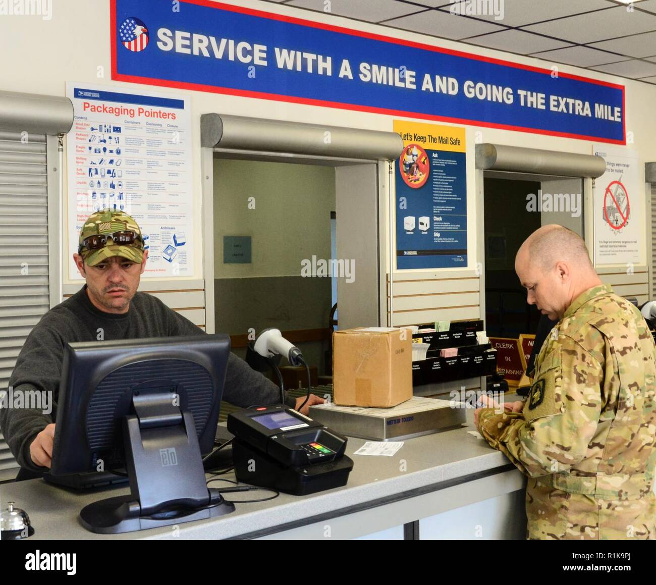 ANSBACH, Germany ( Oct. 10, 2018) Bill McCord, left, a postal clerk