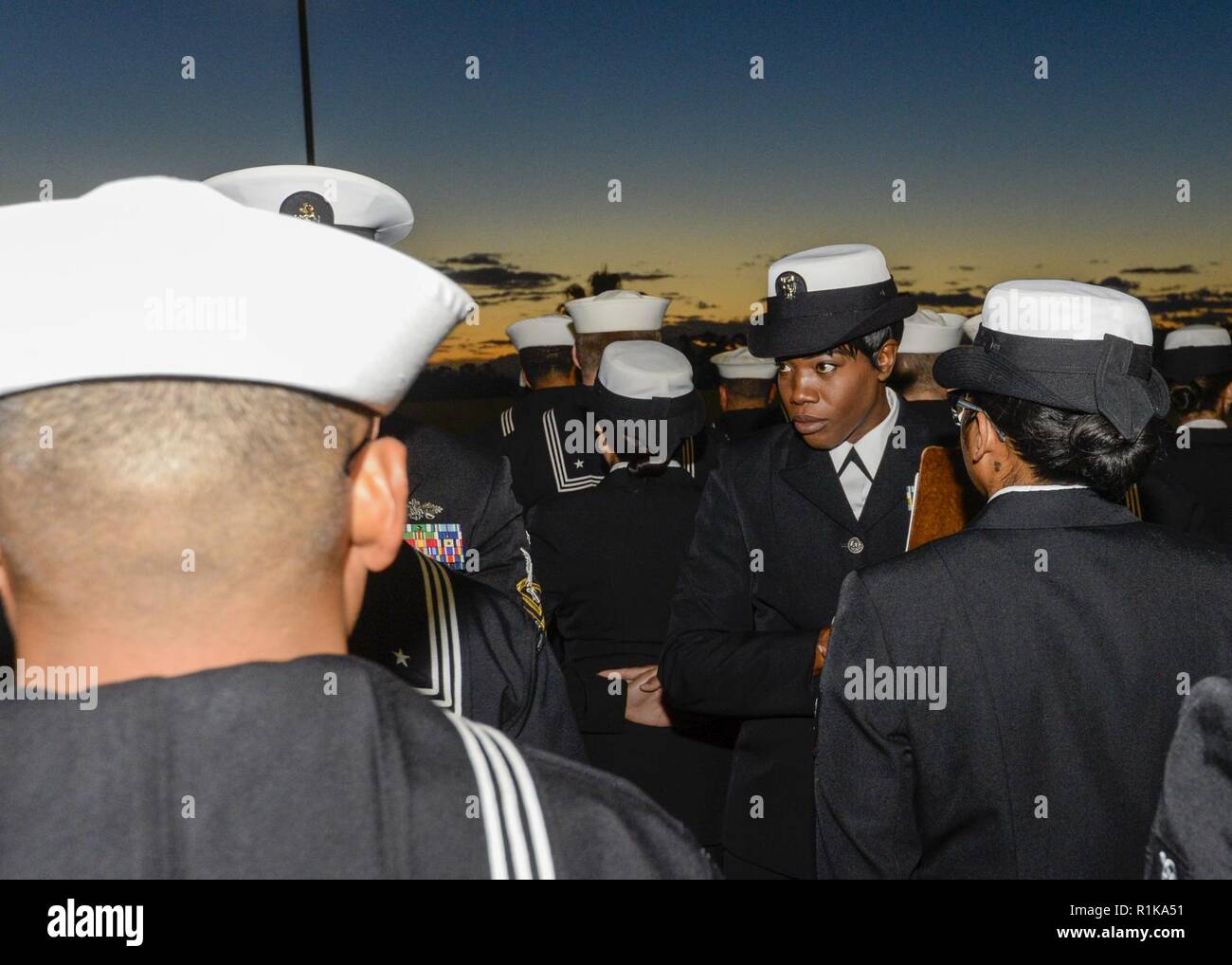 SAN DIEIGO (Oct. 12,2018) — Operations Specialist 1st Class Lawanda Glenn, at Naval Medical Center San Diego (NMCSD) Directorate for Administration (DFA), records discrepancies during a service dress blue uniform inspection in preparation for the seasonal uniform change. NMCSD is the largest naval hospital on the west coast, employing more than 6,000 Sailors, civilians and contractors. Stock Photo