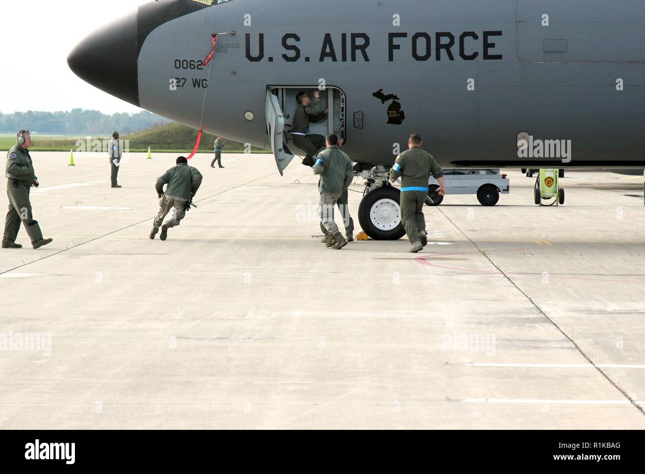 A flight crew from the 171st Air Refueling Squadron enters a KC135