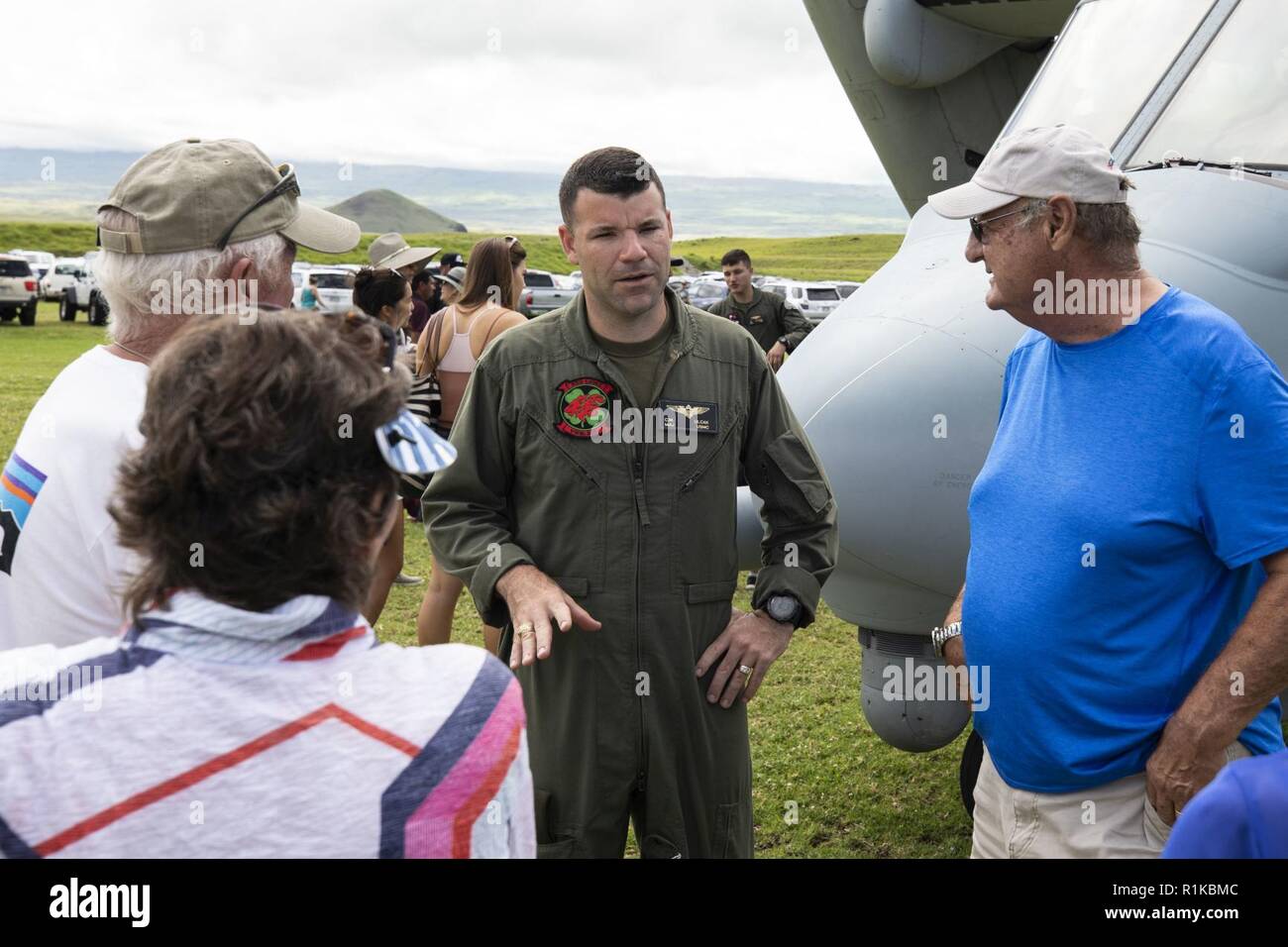 U.S. Marine Corps Maj. Christopher Ulcak, an aircraft commander with Marine Medium Tiltrotor Squadron (VMM) 363, meets with local community members at the Waimea District Park to showcase an Osprey aircraft, Oct. 13, 2018. VMM-363 flew one of their aircraft from Marine Corps Base Hawaii on Oahu to the Waimea Fall Festival, providing a static display and subject matter experts for a first-hand experience to the festival’s attendants. The squadron arrived to Hawaii earlier this year increasing the combat capability and crisis response within the Indo-Pacific region. Stock Photo