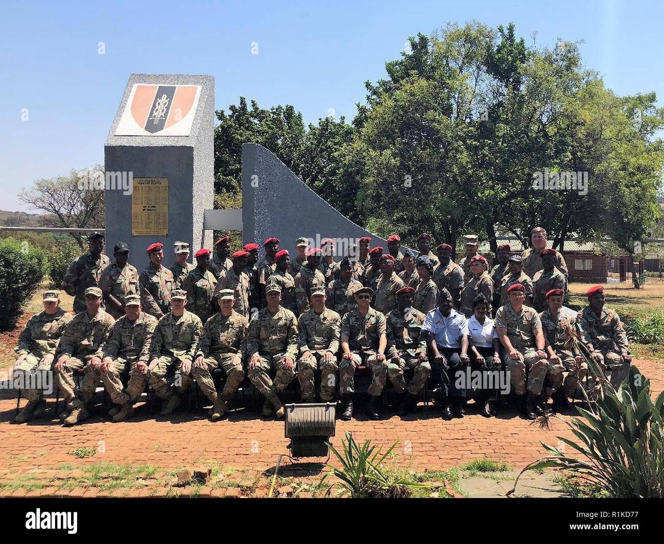 Soldiers from the New York Army National Guard pose with their hosts during an exchange program at the South African National Defense Forces Military Police School during an exchange visit there on Oct. 10-11, 2018. Twelve New York Army National Guard experts in civil support operations, military police, law enforcement, and self-defense took part in the exchange visit. ( U.S. Army National Guard Stock Photo