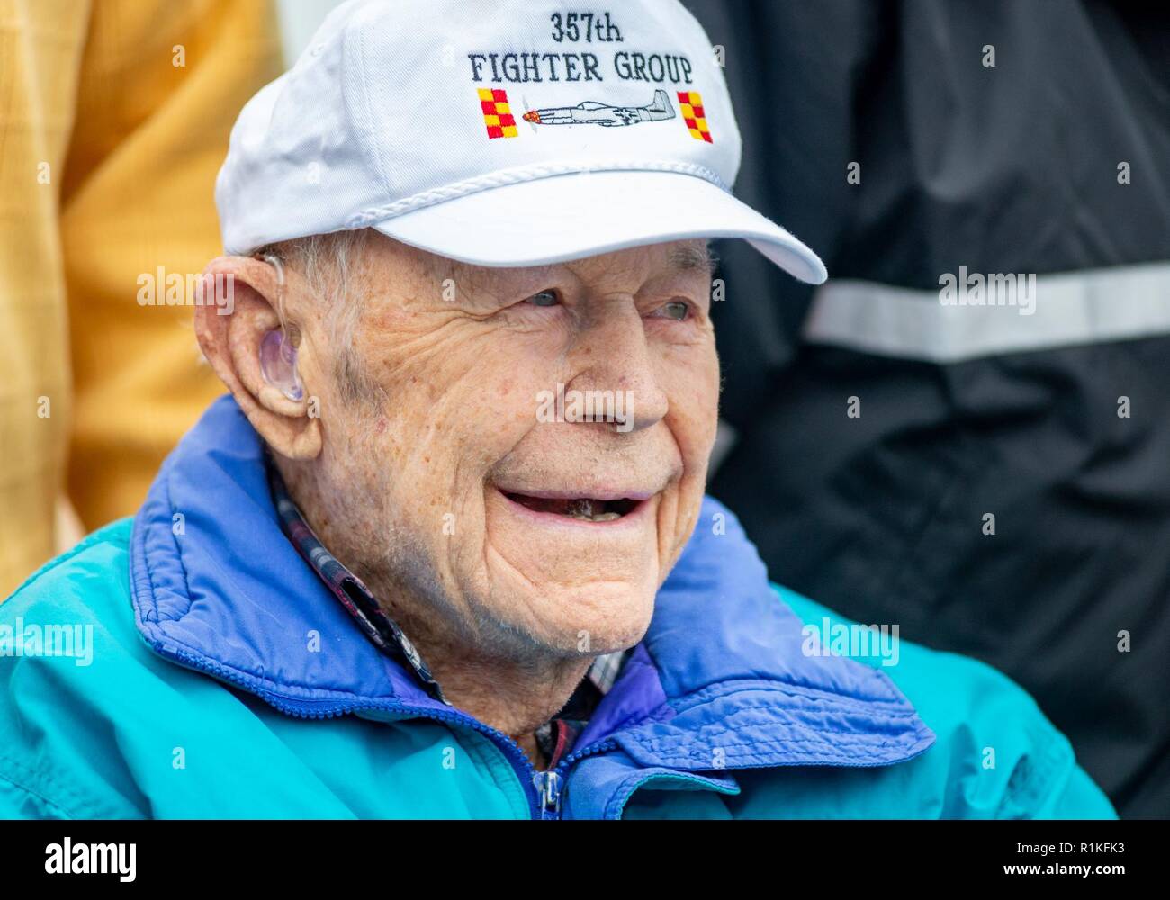Retired General Charles "Chuck" Yeager, 95, smiles at the crowd during