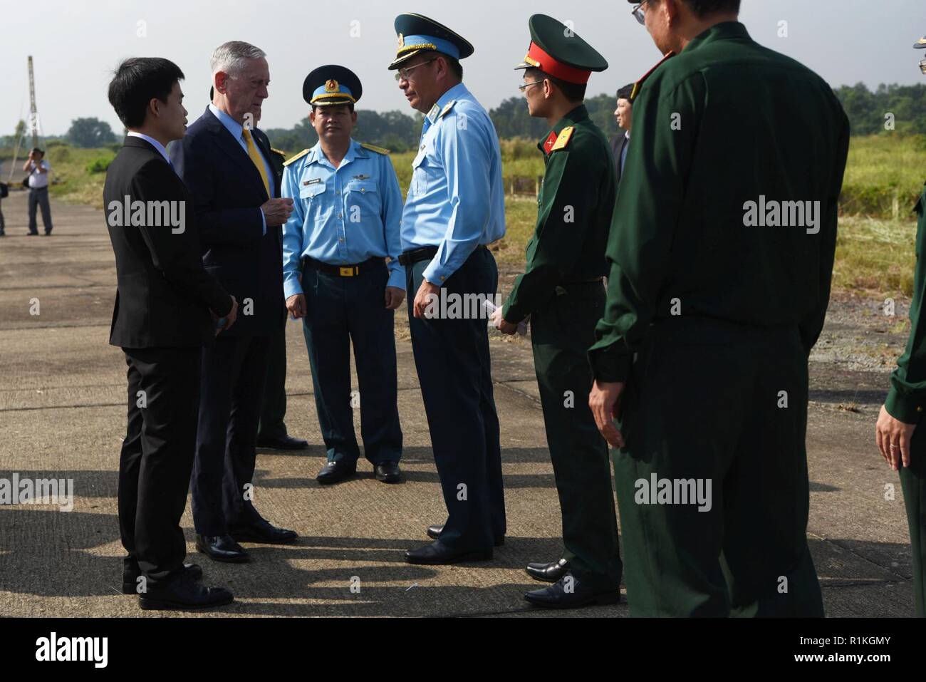 U.S. Secretary of Defense James N. Mattis meets with Vietnamese Maj. Gen. Bui Anh Chung, the deputy commander of the Vietnamese Air Defense Air Force, adjacent to a dioxin-contaminated site at the Bien Hoa Air Base outside Ho Chi Minh City, Vietnam, Oct. 17, 2018. Stock Photo