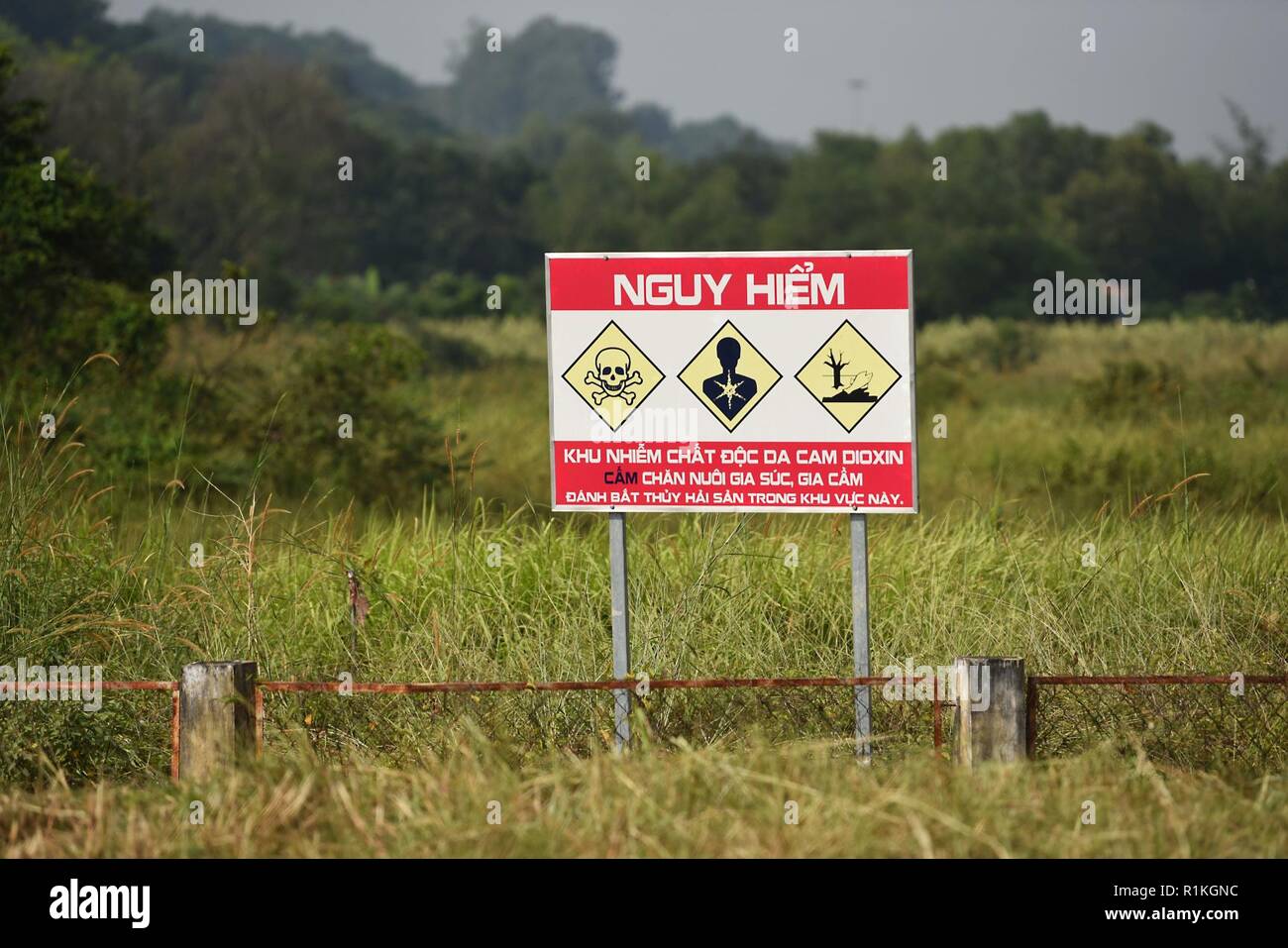 A sign warns of a dioxin-contaminated site at the Bien Hoa Air Base outside Ho Chi Minh City, Vietnam, seen during a visit by U.S. Secretary of Defense James N. Mattis, Oct. 17, 2018. Stock Photo